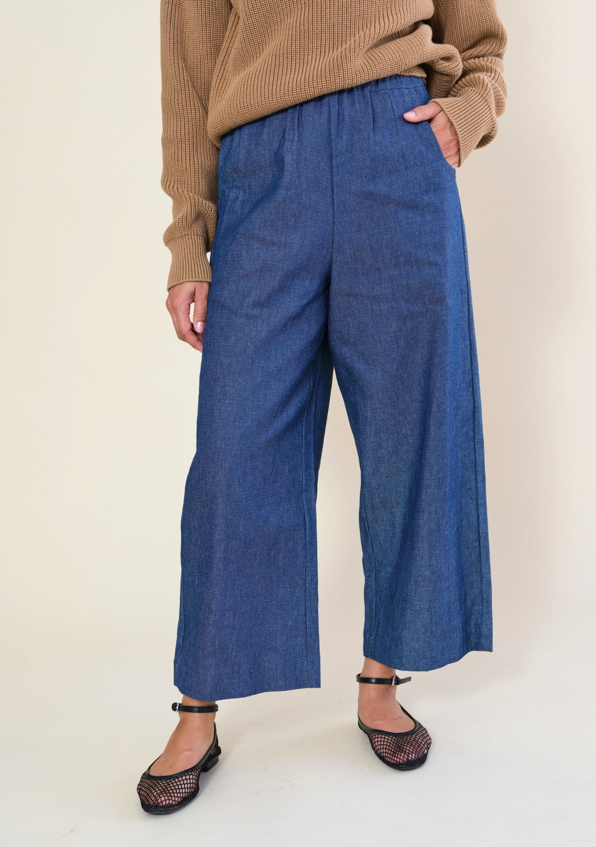 Women's blue deadstock denim wide leg pants with cropped length and elastic waistband by Poplinen