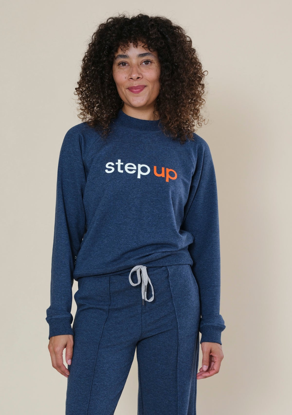 Step Up x Poplinen women's raglan sweatshirt with Step Up logo across the chest, made from organic cotton and TENCEL French terry