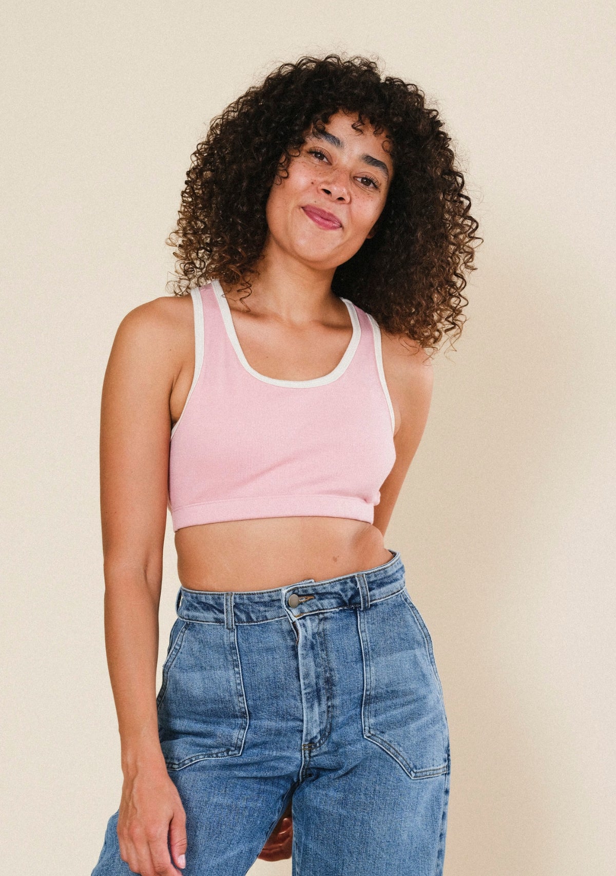 Woman wearing Poplinen Penelope ribbed bralette with contrasting cream trim and a comfortable, close-to-body fit