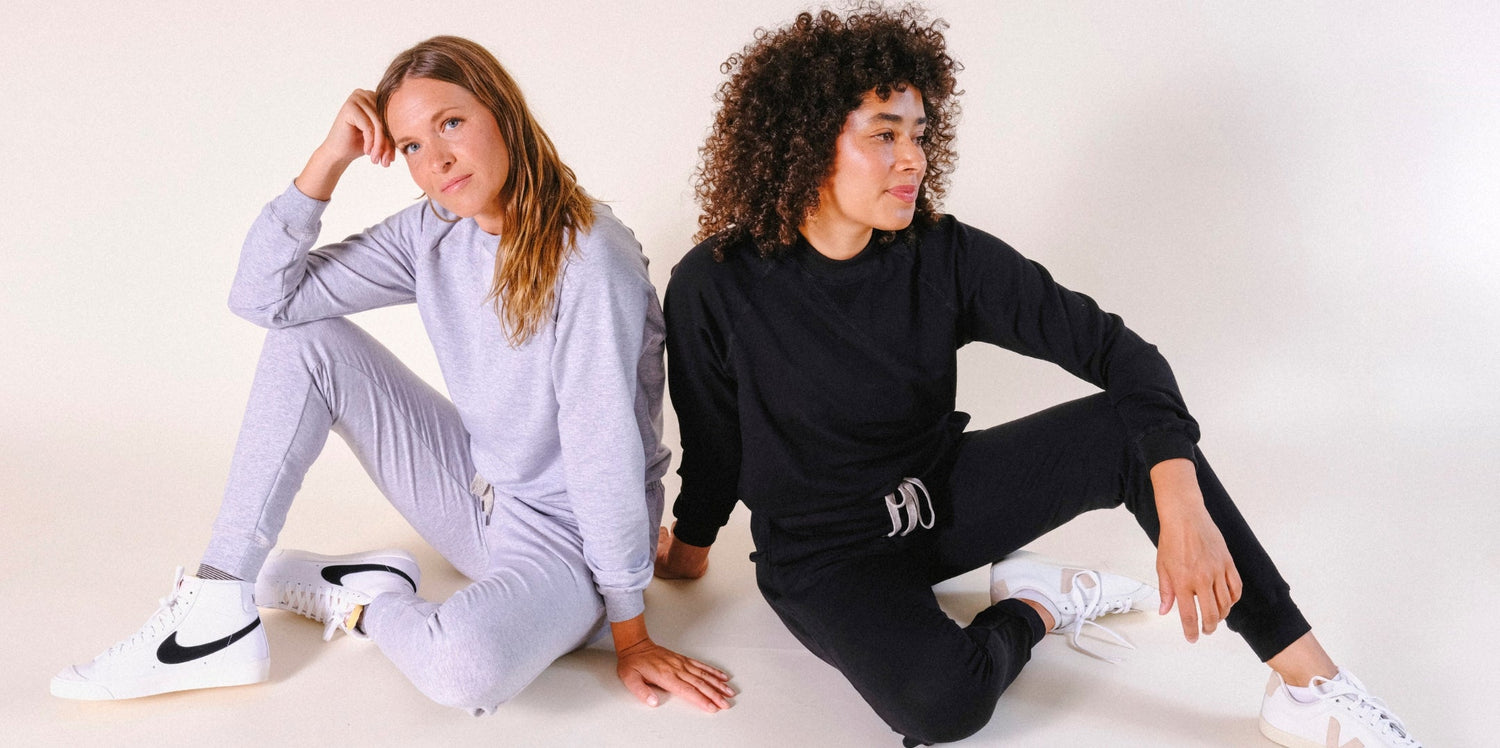 Two humans wearing Tencel POPLINEN sweatsuits
