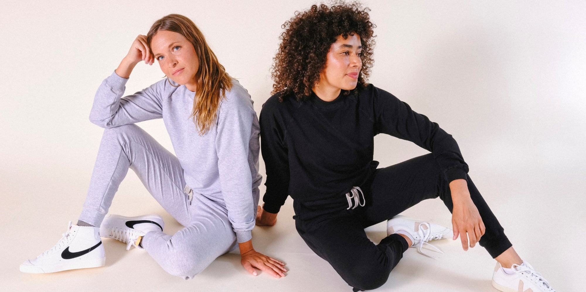 Two humans wearing Tencel POPLINEN sweatsuits