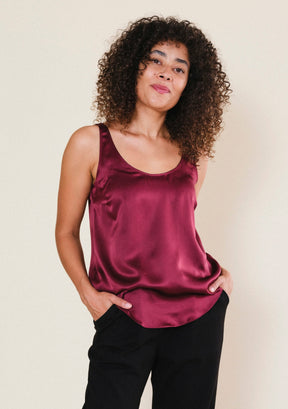 Woman wearing Poplinen Isa silk tank top in Port burgundy with a relaxed, flattering fit