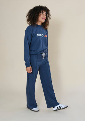 Woman modeling Step Up x Poplinen raglan crewneck sweatshirt with relaxed everyday styling