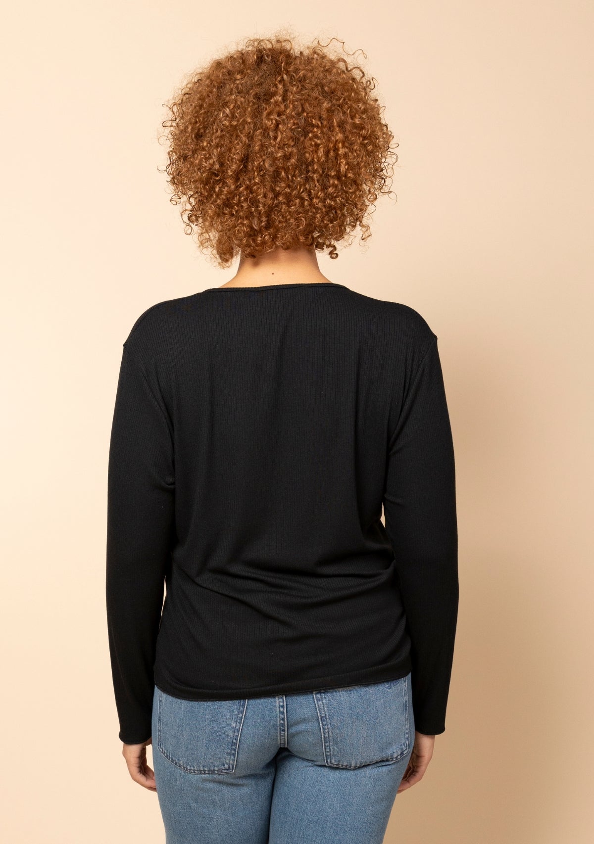 Hedy Modal Ribbed V Neck Long Sleeve Tee in Black, back view.
