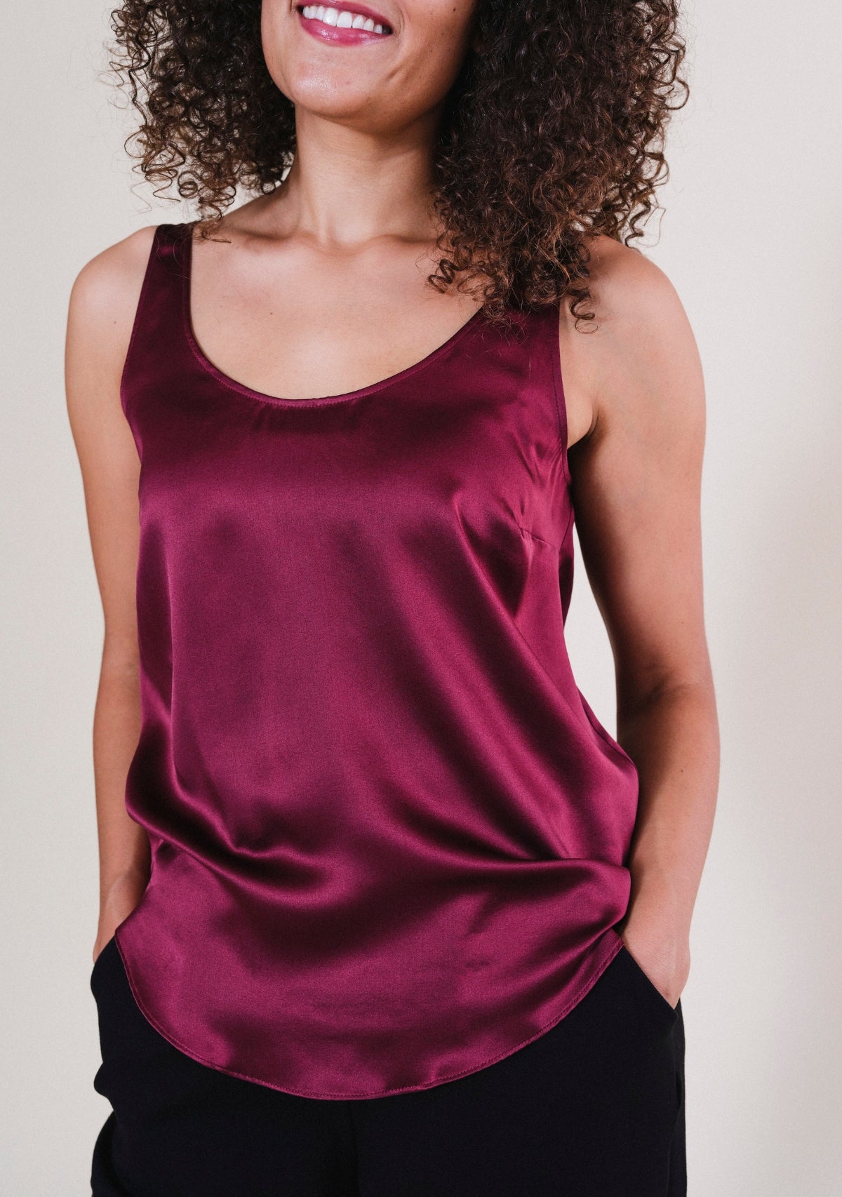 Close-up of bust darts on Isa silk tank top in Port for a gently tailored silhouette