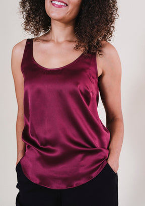 Close-up of bust darts on Isa silk tank top in Port for a gently tailored silhouette