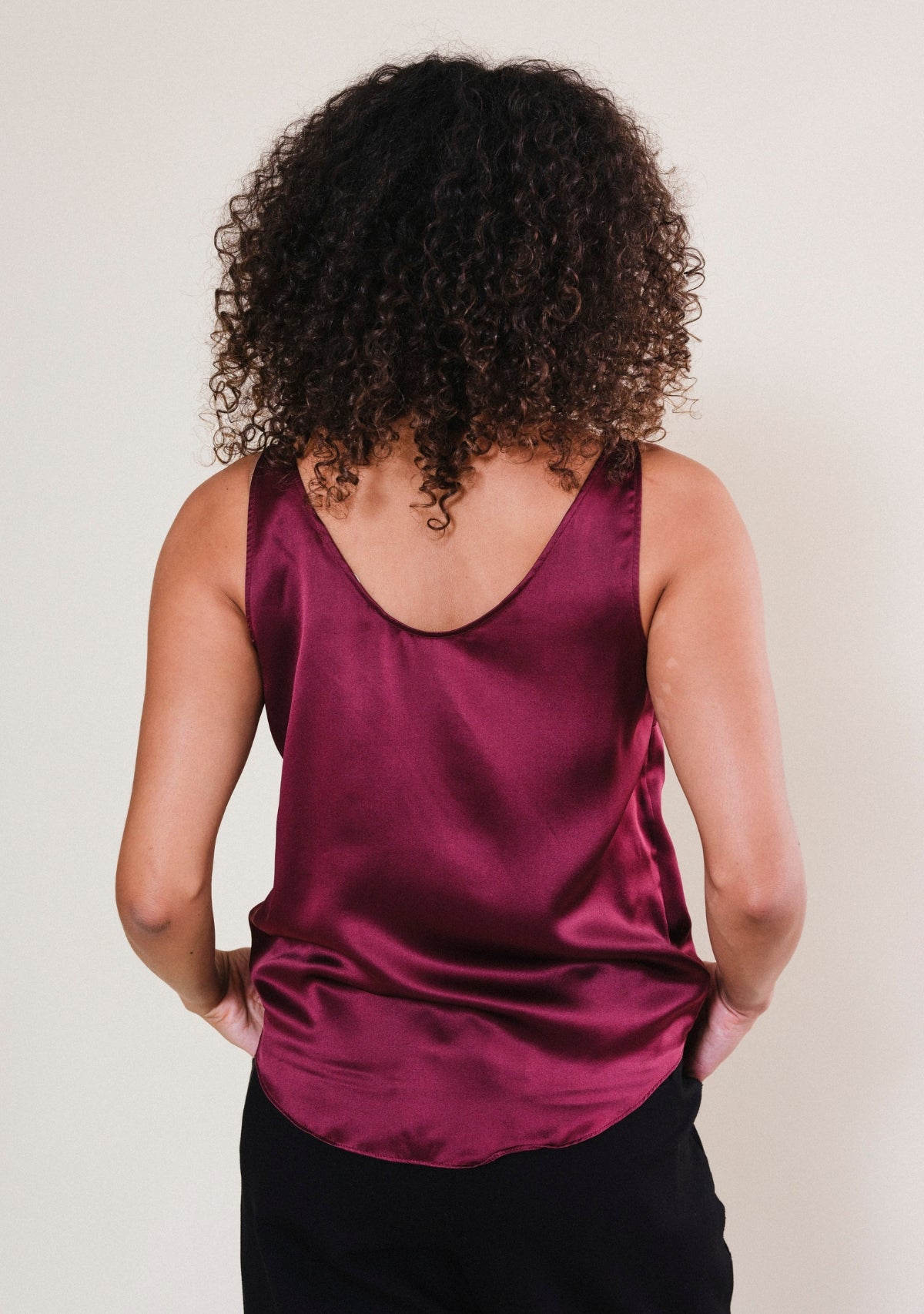 Back view of Isa silk tank top in rich Port burgundy with smooth silk fabric and relaxed silhouette
